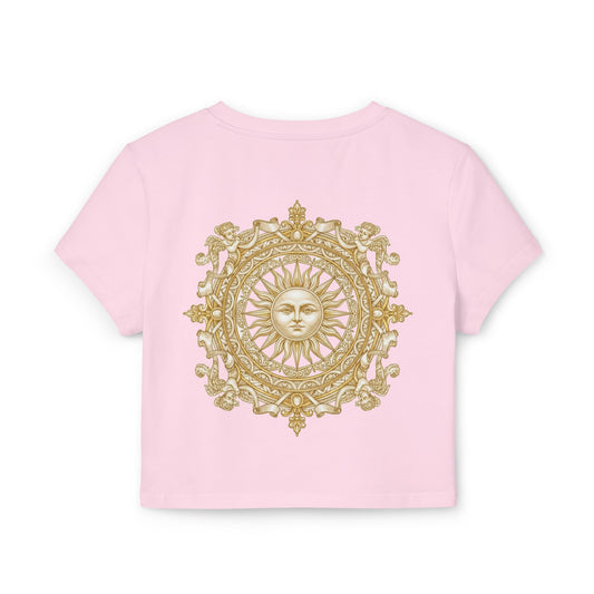 Gold sun medallion printed on the back of a cropped organic cotton baby tee