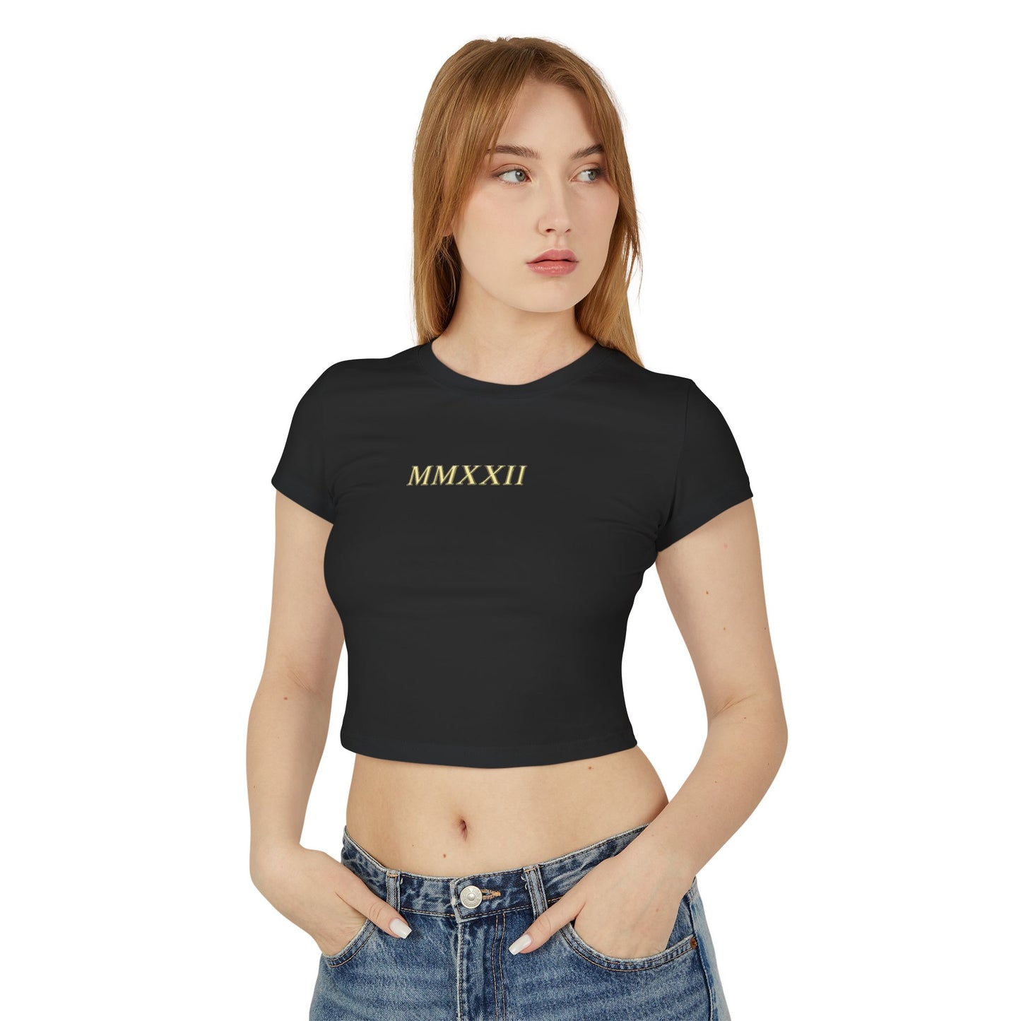 Gold sun medallion printed on the back of a cropped organic cotton baby tee