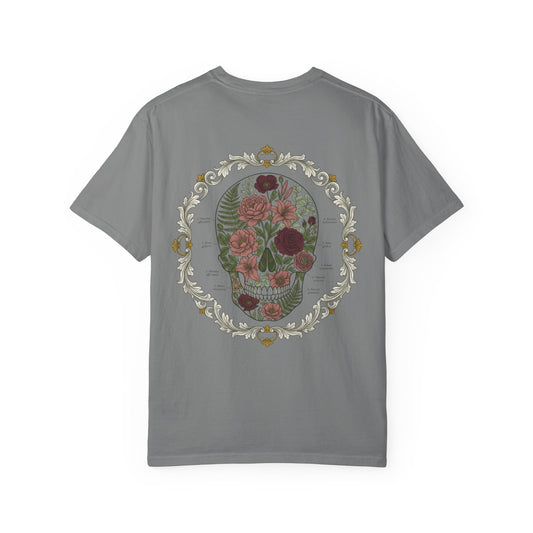 Floral skull framed in botanical scrollwork printed on the back of a garment-dyed cotton tee