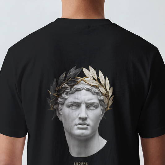 Classical marble bust crowned with laurel printed on the back of a garment-dyed heavyweight cotton tee