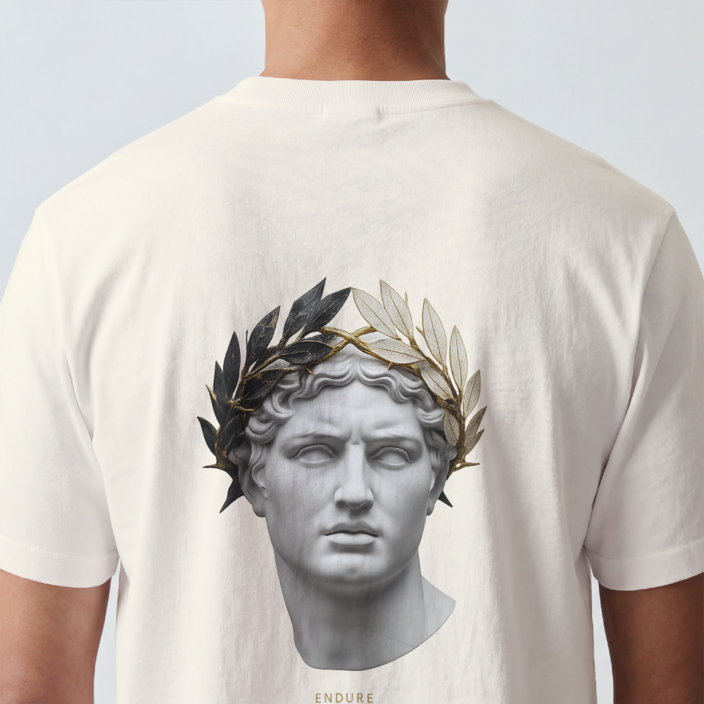 Classical marble bust crowned with laurel printed on the back of a garment-dyed heavyweight cotton tee