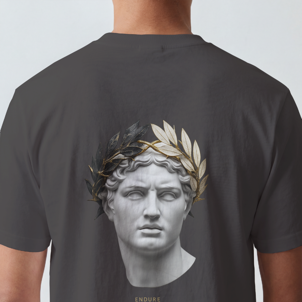 Classical marble bust crowned with laurel printed on the back of a garment-dyed heavyweight cotton tee
