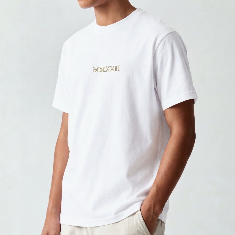 Ornate gold sun medallion printed on the back of a garment-dyed heavyweight cotton tee