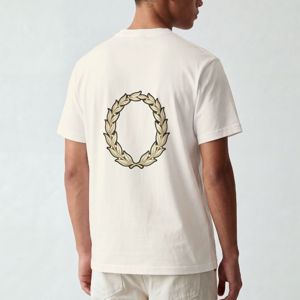 Hand-drawn gold laurel wreath printed on the back of a garment-dyed heavyweight cotton tee