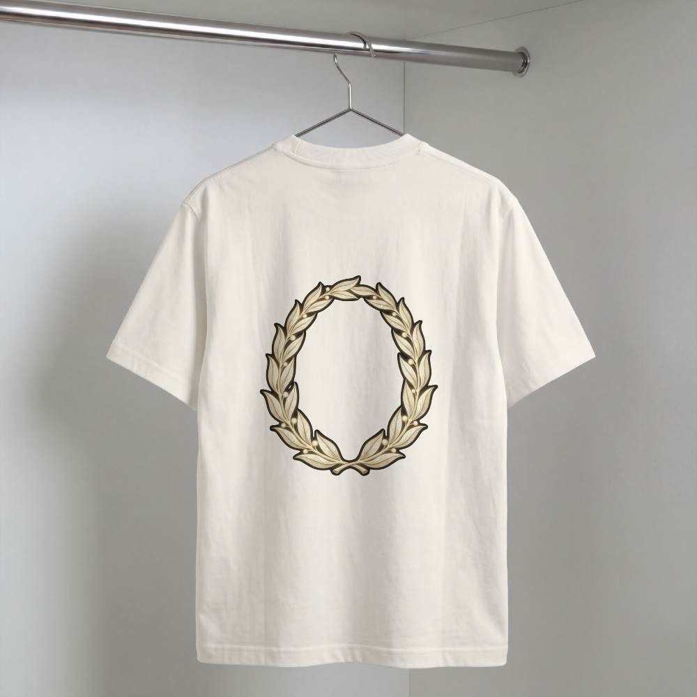 Hand-drawn gold laurel wreath printed on the back of a garment-dyed heavyweight cotton tee