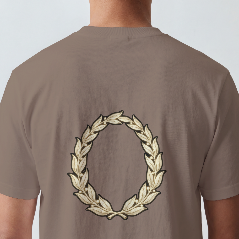 Hand-drawn gold laurel wreath printed on the back of a garment-dyed heavyweight cotton tee