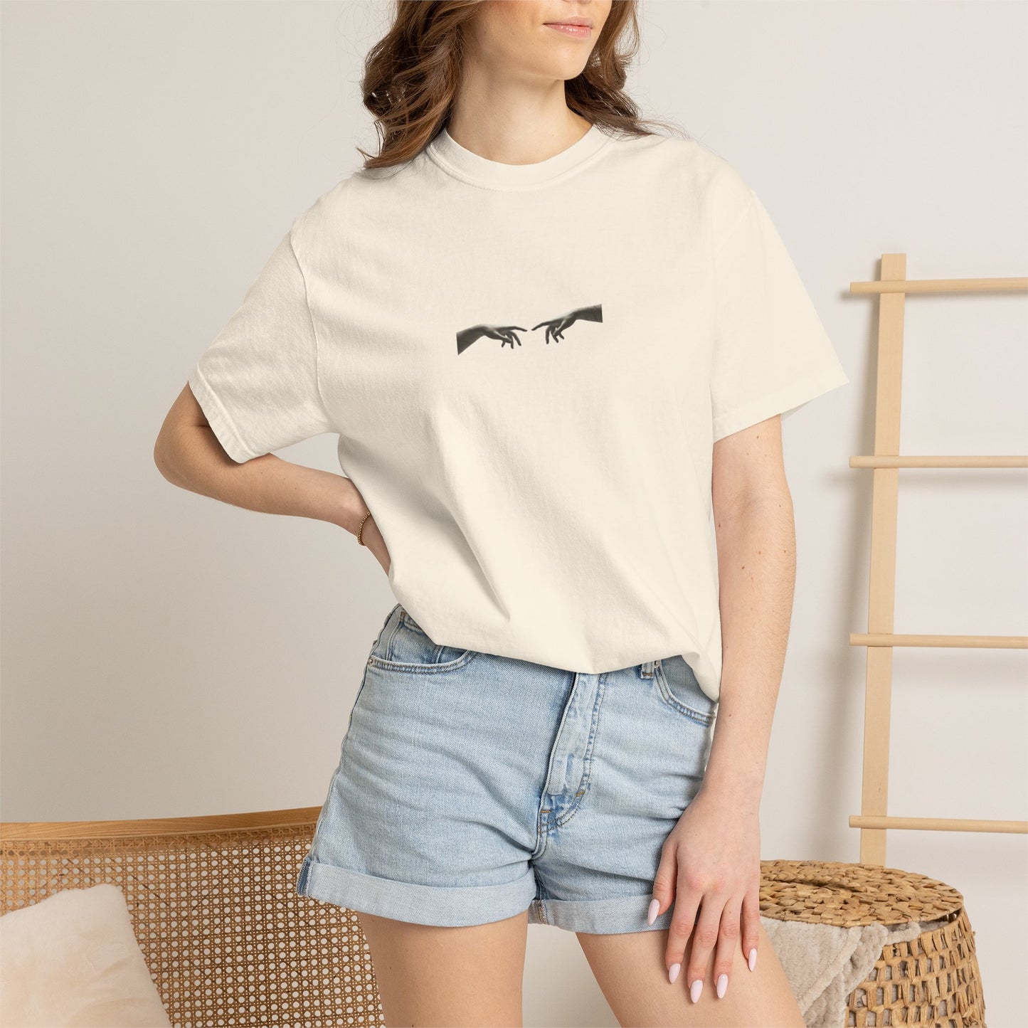 Sculpted Apollo bust with geometric stars on the back of a garment-dyed heavyweight cotton tee