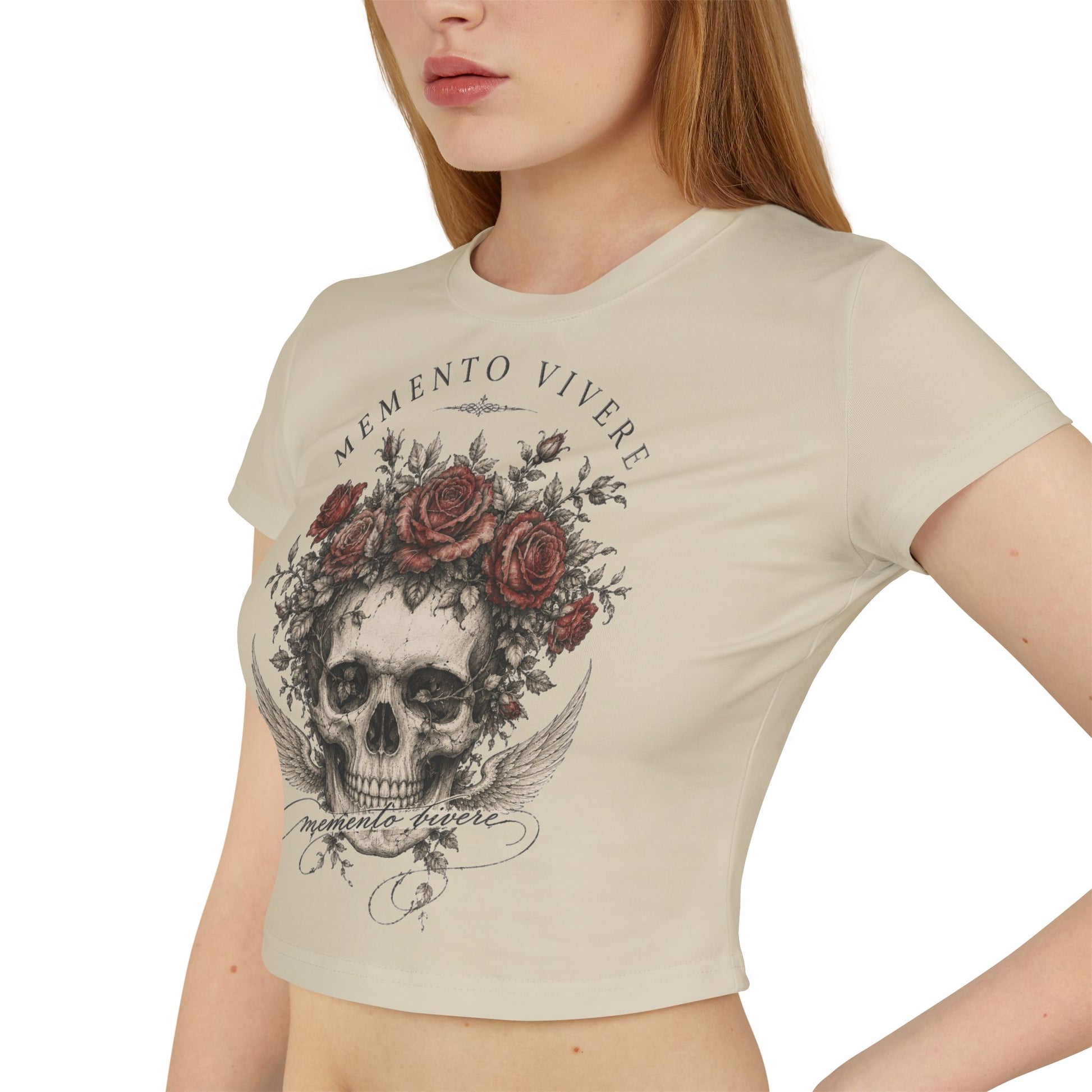 Distressed skull crowned with red roses on a cropped organic cotton baby tee