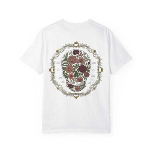 Floral skull framed in botanical scrollwork printed on the back of a garment-dyed cotton tee