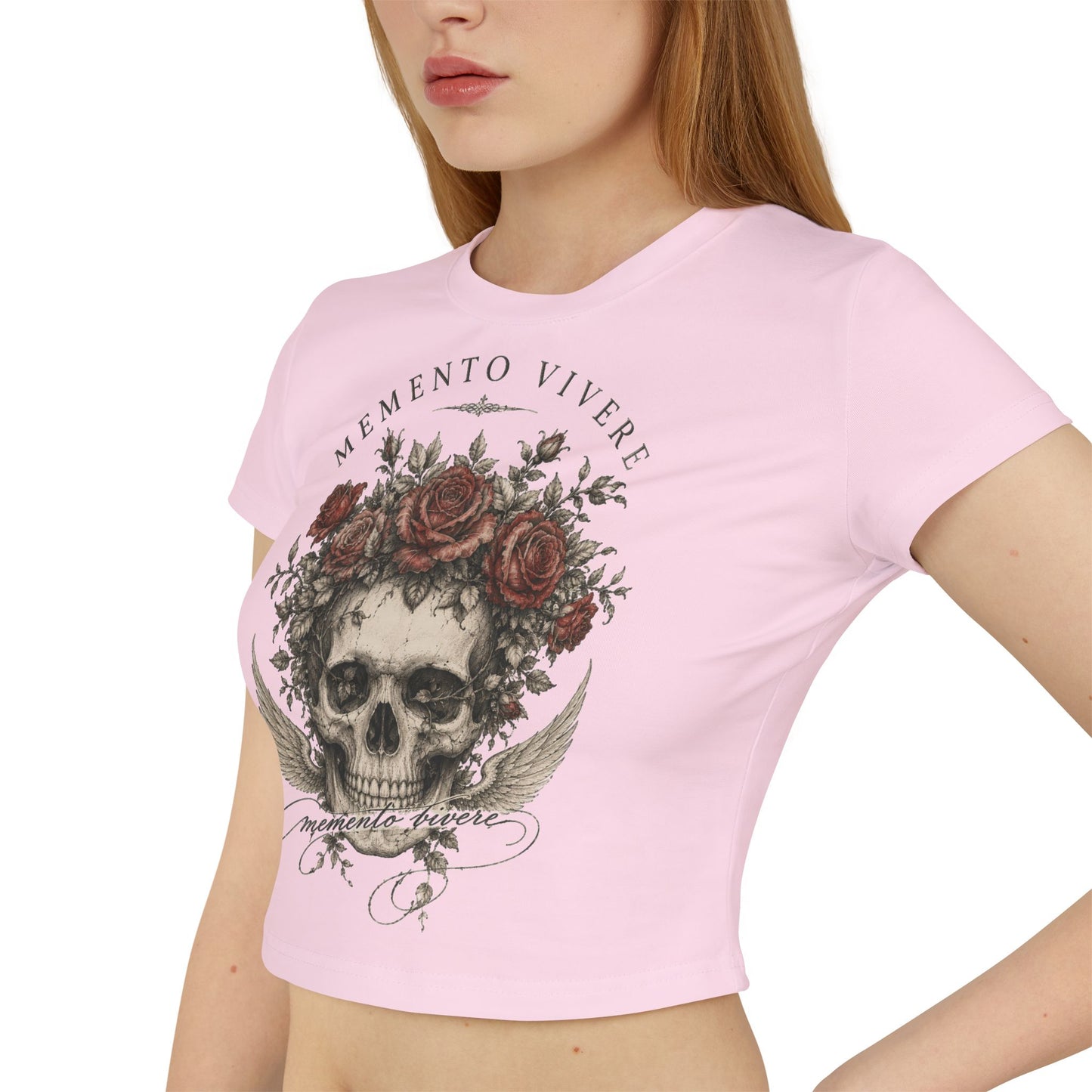 Distressed skull crowned with red roses on a cropped organic cotton baby tee
