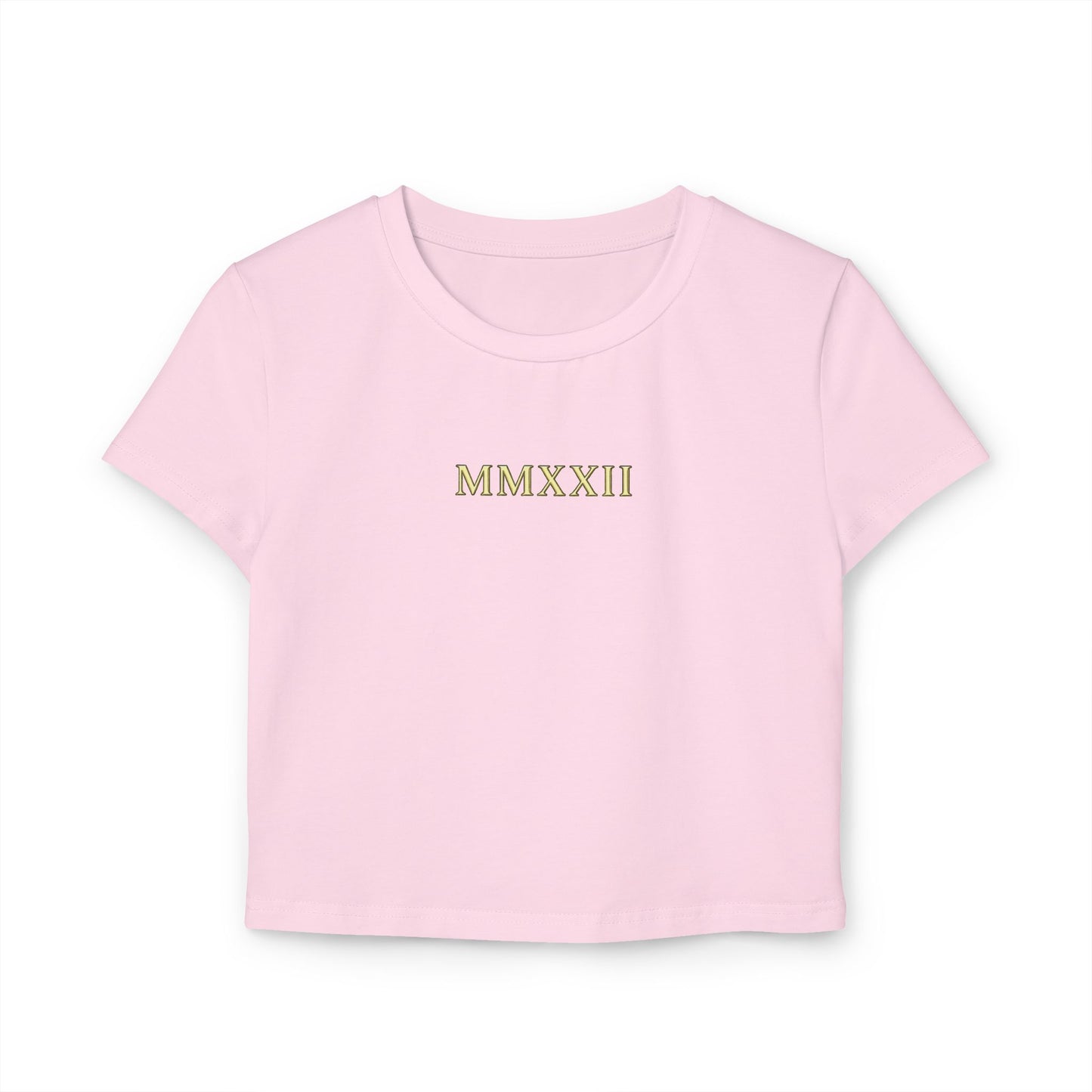 Gold sun medallion printed on the back of a cropped organic cotton baby tee