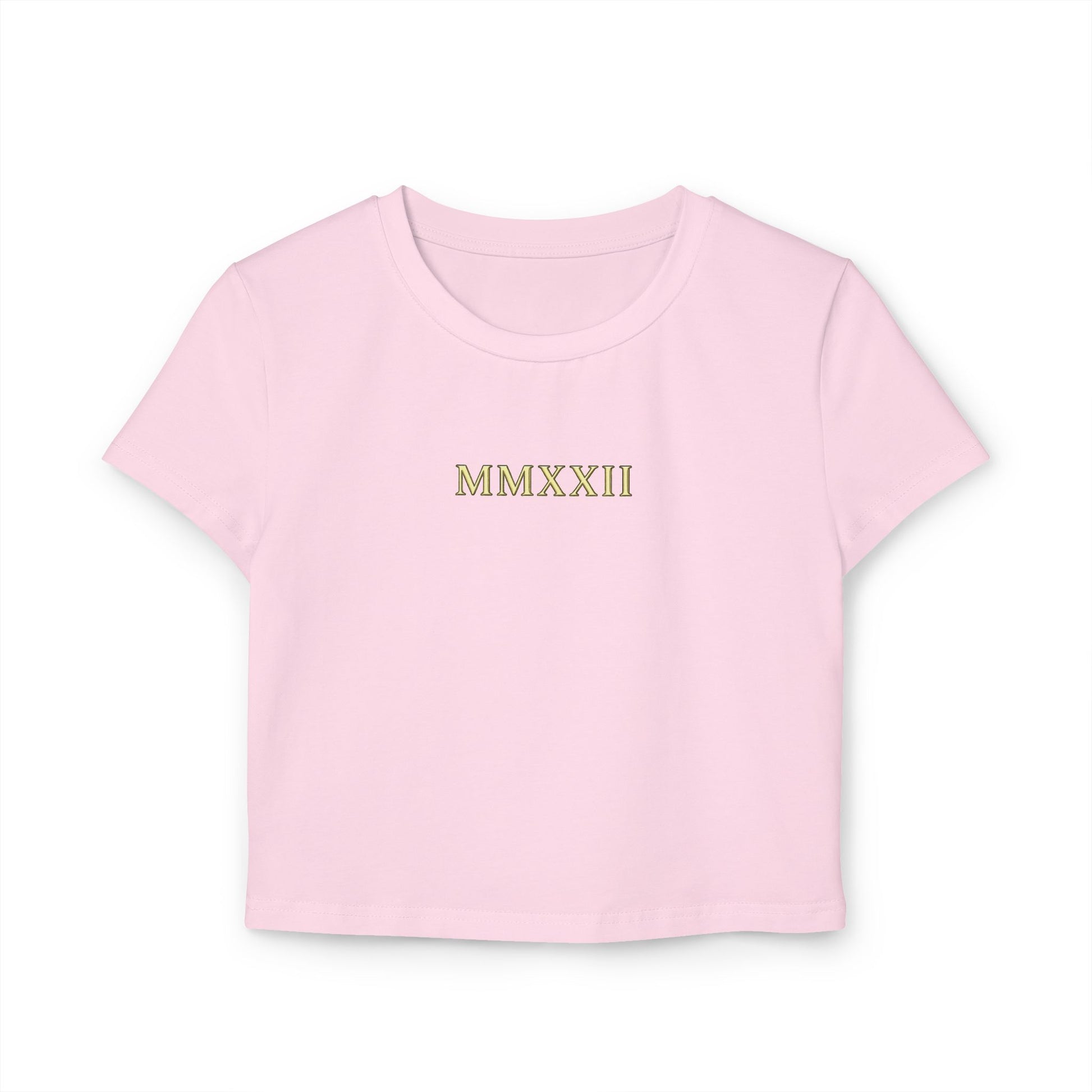 Gold sun medallion printed on the back of a cropped organic cotton baby tee